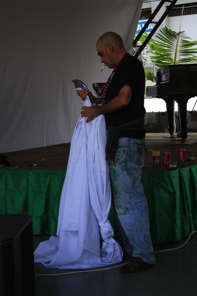 Mikhail on stage with the canvas cloth
