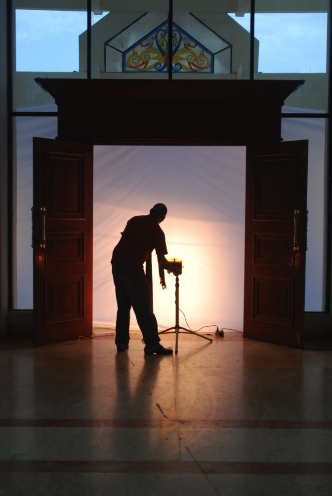 Mikhail’s silhouette behind the canvas